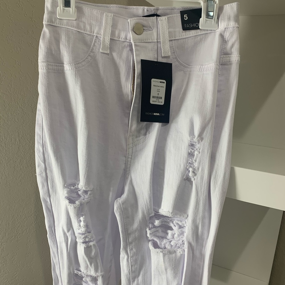 White ripped Fashion Nova jeans.